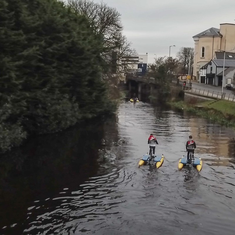 a group of people on a boat in the water