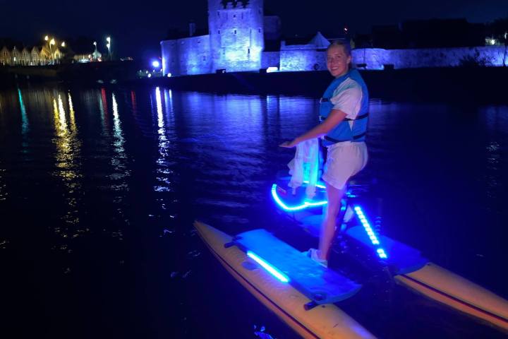 a person standing next to a body of water