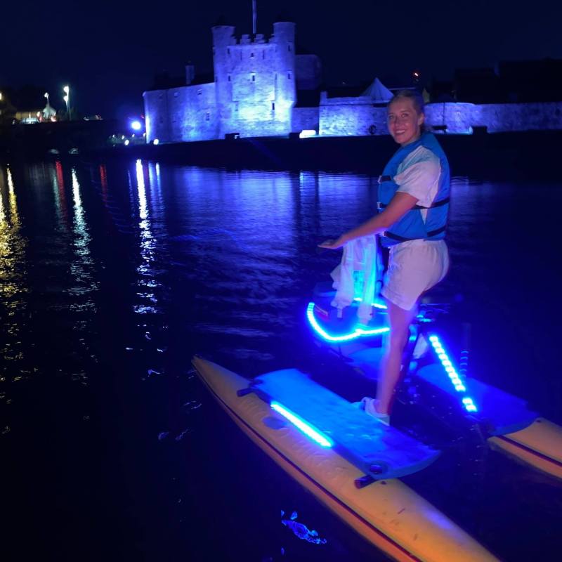 a person standing next to a body of water