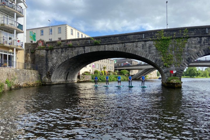 a train crossing a bridge over a river