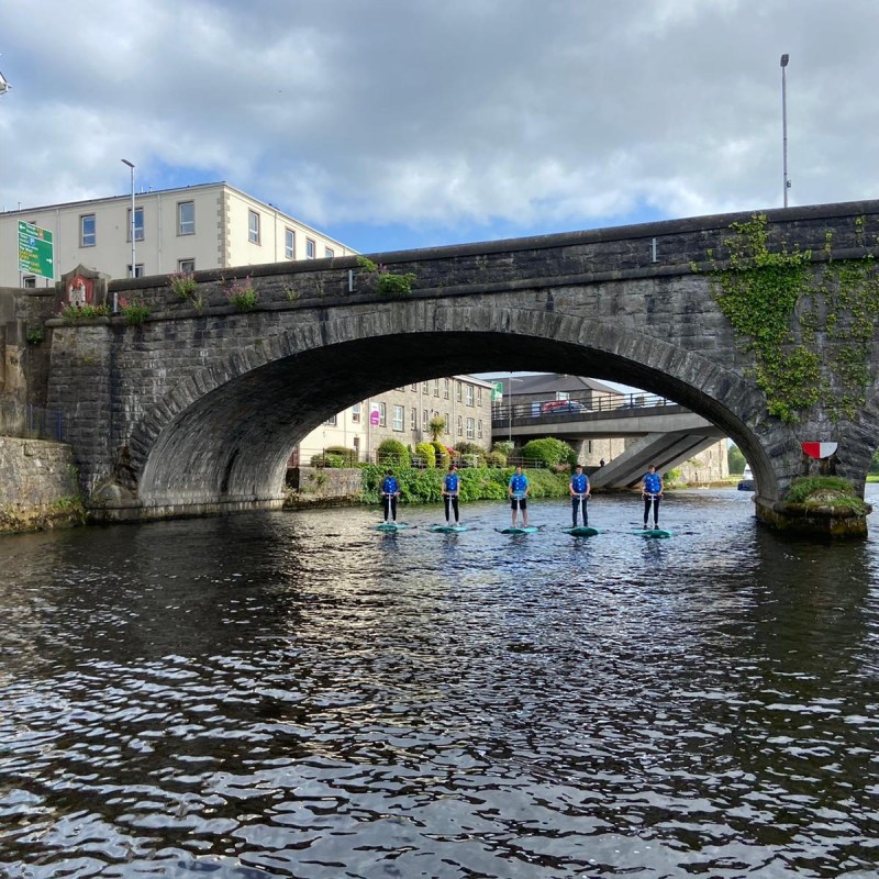 a train crossing a bridge over a river