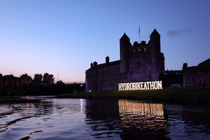 a castle surrounded by a body of water